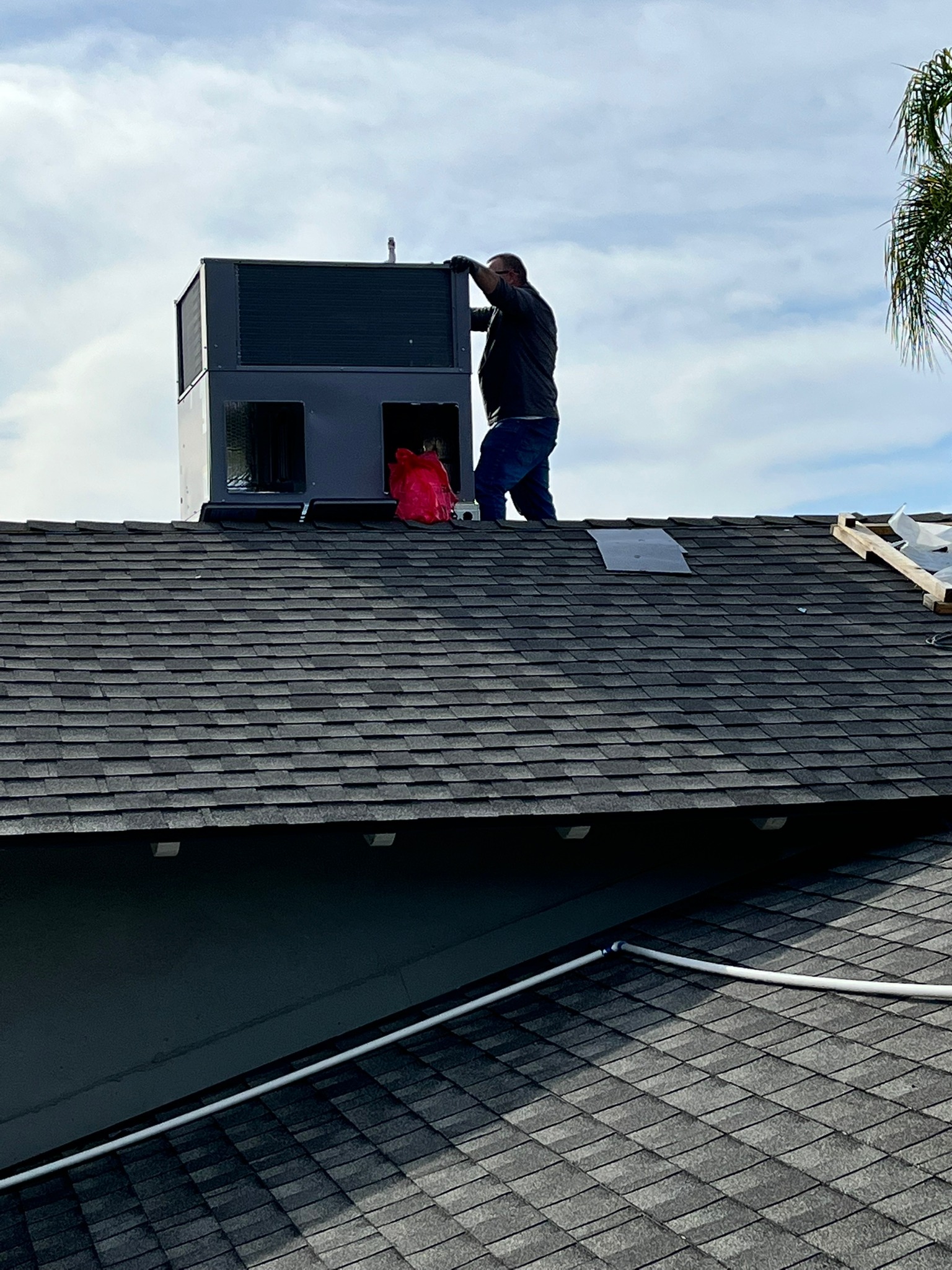 Rooftop HVAC Unit Maintenance by Professional Technician