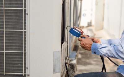 A close-up of a technician checking refrigerant levels during AC maintenance outdoors.